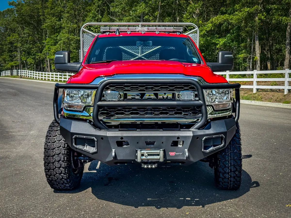 Right-side lower body detail with intake/fill fittings and marker lights.